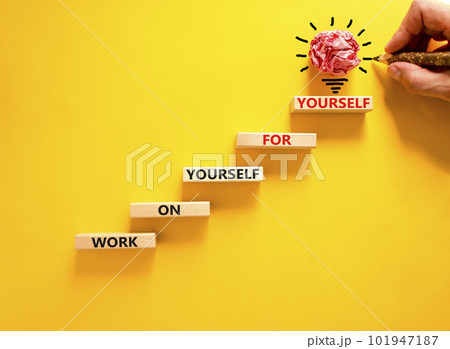 Work for yourself symbol. Concept words Work on yourself for yourself on wooden block. Beautiful yellow table yellow background. Businessman hand. Business and work for yourself concept. Copy space. 101947187