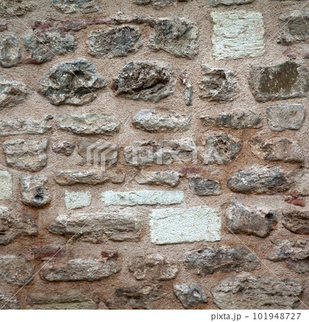 Sturdy beige and purple cut stone wall, seamless lined up Sturdy beige and purple cut stone wall, seamless lined up 101948727