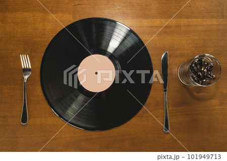 Music lover breakfast. Vinyl record and audio cassette instead food  101949713