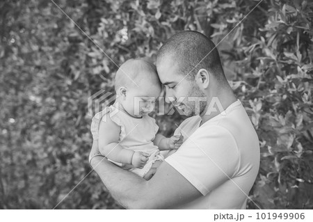 father and daughter leaned their heads to each other in the garden father and daughter leaned their heads to each other in the garden 101949906
