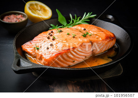 Salmon steak on a black plate with herbs and spices on a black background. Generative AI Salmon steak on a black plate with herbs and spices on a black background. Generative AI 101956507