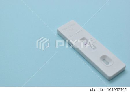 covid test kit on blue background 101957565