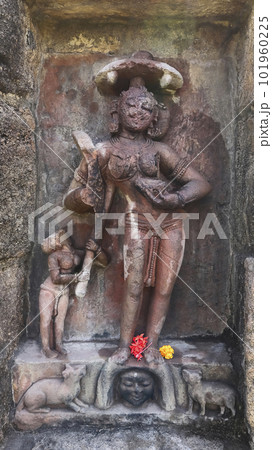 Katayani Images on exterior niches of the 2m high circular temple wall. Each holding a blade in hand and a severed head at the base. Yogini Temple, Hirapur, Bhubaneshwar, Odisha, India. 101960225