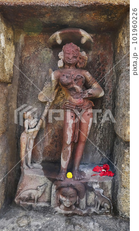Katayani Images on exterior niches of the 2m high circular temple wall. Each holding a blade in hand and a severed head at the base. Yogini Temple, Hirapur, Bhubaneshwar, Odisha, India. Katayani Images on exterior niches of the 2m high circular temple wall. Each holding a blade in hand and a severed head at the base. Yogini Temple, Hirapur, Bhubaneshwar, Odisha, India. 101960226