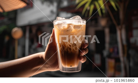 Glass of traditional vietnamese coconut ice coffee in woman hand. Illustration AI Generative 101965860