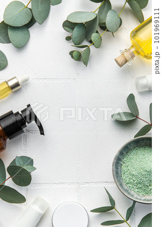Eucalyptus, towel, massage salt, aroma oil,  spa objects on white tile background. 101969111