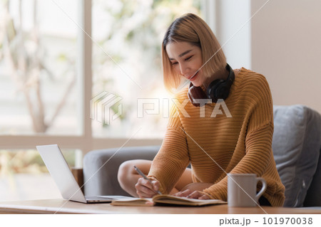 Attractive Asian woman resting comfortable living room and using laptop computer, Relax, Sofa, Lifestyle Attractive Asian woman resting comfortable living room and using laptop computer, Relax, Sofa, Lifestyle 101970038