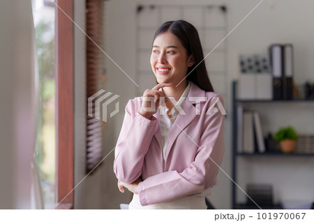 Asian Business person makes analysis and research financial report at office, analyzes profits. Accountant checks status of financial 101970067
