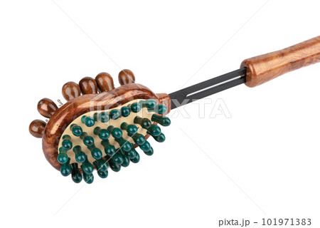 Massage brush for the body with wooden rows of teeth on a white background. 101971383