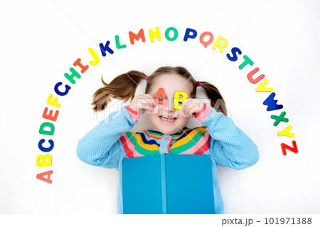 Child learning letters of alphabet and reading Child learning letters of alphabet and reading 101971388