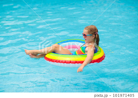 Child in swimming pool on toy ring. Kids swim. Child in swimming pool on toy ring. Kids swim. 101971405