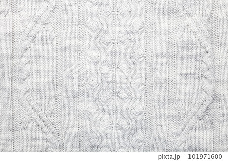 Heather grey cable knit fabric textured background Heather grey cable knit fabric textured background 101971600