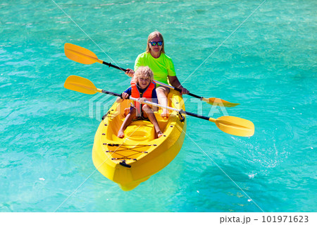 Kids kayaking in ocean. Family in kayak in tropical sea 101971623