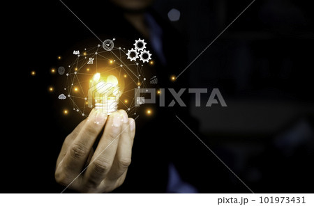 Business People touch Light bulb.Concept of Ideas for Success. Concept with Innovation Invention. Success Starting from a new idea to innovative technology based on data from the Internet, big data. Business People touch Light bulb.Concept of Ideas for Success. Concept with Innovation Invention. Success Starting from a new idea to innovative technology based on data from the Internet, big data. 101973431