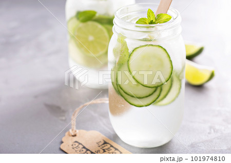 Lime and cucumber lemonade in mason jars Lime and cucumber lemonade in mason jars 101974810
