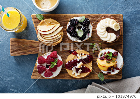 Variety of bagels on a board Variety of bagels on a board 101974970