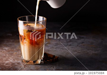 Hot masala tea with milk Hot masala tea with milk 101975084