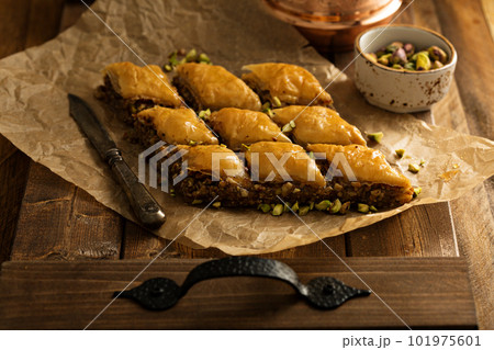 Homemade baklava with pistachios and hazelnuts Homemade baklava with pistachios and hazelnuts 101975601