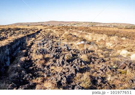 Peat Turf cutting in County Donegal - Ireland 101977651