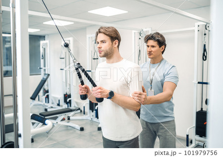 Man having a workout in a gym in a rehabilitation center Man having a workout in a gym in a rehabilitation center 101979756