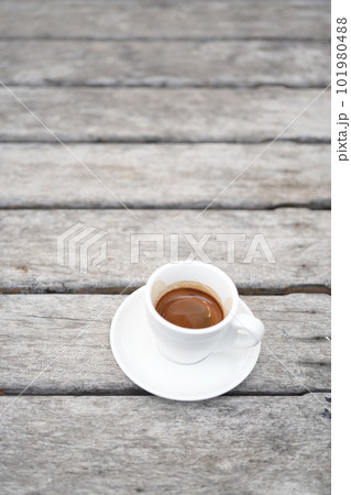 small white coffee cup on grey grunge wooden table 101980488