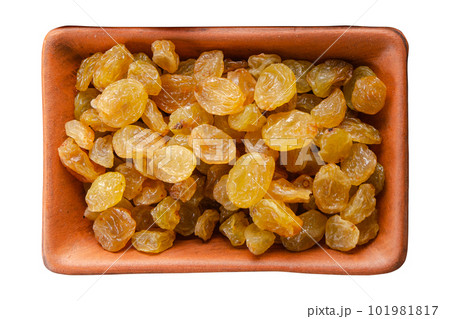 Raisins in clay bowl isolated on white flat lay view Raisins in clay bowl isolated on white flat lay view 101981817