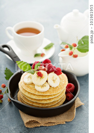 Fluffy buttermilk pancakes with bananas Fluffy buttermilk pancakes with bananas 101981955