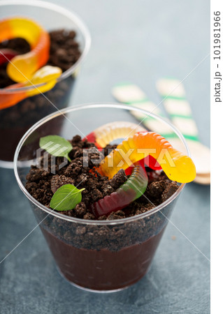 Children chocolate dessert in a cup dirt and worms Children chocolate dessert in a cup dirt and worms 101981966