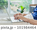 Caucasian patient using laptop in hospital room. man sick patient lying in a hospital bed 101984464