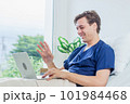 Caucasian patient using laptop in hospital room. man sick patient lying in a hospital bed 101984468
