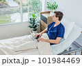 Caucasian patient using laptop in hospital room. man sick patient lying in a hospital bed 101984469