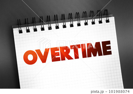 Overtime - amount of time someone works beyond normal working hours, text on notepad concept background Overtime - amount of time someone works beyond normal working hours, text on notepad concept background 101988074