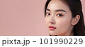 Asian woman with a beautiful face against light pink background - portrait shot - made with 101990229