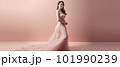 Asian woman with a beautiful face against light pink background - full body studio shot - made with 101990239