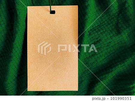 Blank fashion label tag, sale price card on luxury fabric background, shopping and retail Blank fashion label tag, sale price card on luxury fabric background, shopping and retail 101990351