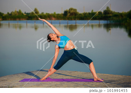 girl doing yoga exercise girl doing yoga exercise 101991455