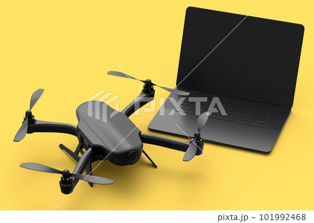 Top view of workspace and photography gear like laptop and drone on yellow Top view of workspace and photography gear like laptop and drone on yellow 101992468
