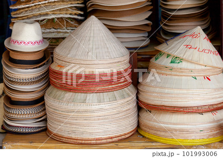 Straw hats for sale on a market stall Straw hats for sale on a market stall 101993006