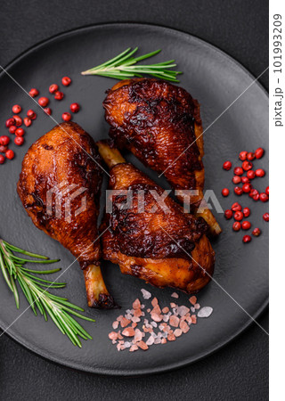 Delicious grilled chicken legs with spices and herbs in teriyaki sauce 101993209