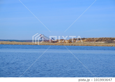 Piles of logs from the timber industry are ready for export. in the distance stacks of logs for export by sea 101993647
