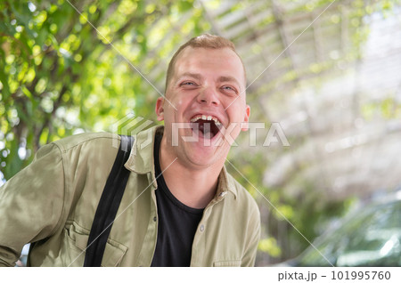 Happy caucasian man with hearing aids outdoors. Happy caucasian man with hearing aids outdoors. 101995760