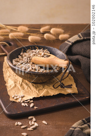 Sunflower seeds in a ceramic bowl Sunflower seeds in a ceramic bowl 102002146
