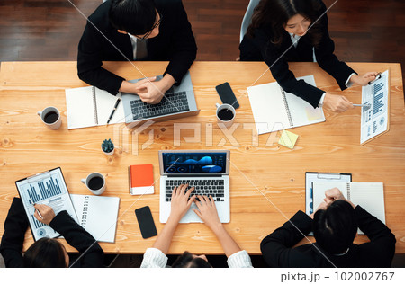 Business team of financial data analysis meeting report paper in harmony office. Business team of financial data analysis meeting report paper in harmony office. 102002767