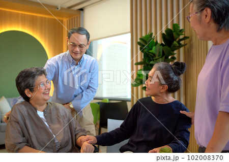 Happy cheerful Asian elder people sitting in living room and talking together, a long friendship or relationship in people concept. Group of senior elder person meeting and talking. Happy cheerful Asian elder people sitting in living room and talking together, a long friendship or relationship in people concept. Group of senior elder person meeting and talking. 102008370