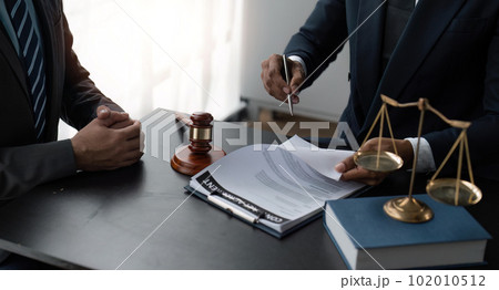 Consultation and conference of Male lawyers and businesswoman working and discussion having at law firm 102010512