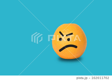 Orange face angry on blue background. Orange face angry on blue background. 102011702