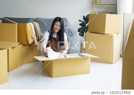 Modern female people in moving home apartment leisure indoor activity alone. Modern female people in moving home apartment leisure indoor activity alone. 102012466