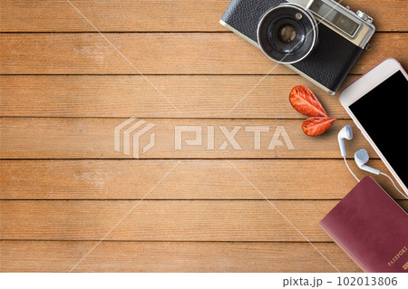 Vintage Camera and Passport on Wooden Background 102013806