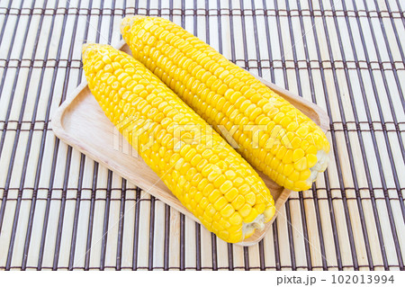 Boiled corn in wooden plate Boiled corn in wooden plate 102013994