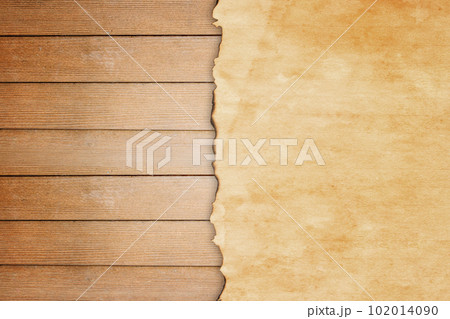 Grunge paper on wooden wall background 102014090